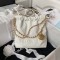 CHANEL 22 MINI HANDBAG Shiny Grained Calfskin, Gold-Tone & Lacquered White AS3980